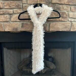Off white colored fluffy scarf